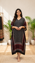 Woman wearing a black and red patterned V neck Kaftan by Kutch Poshak